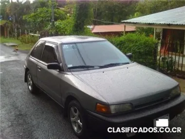 Mazda 323, año 91, full extras, o cambio por auto mayor precio